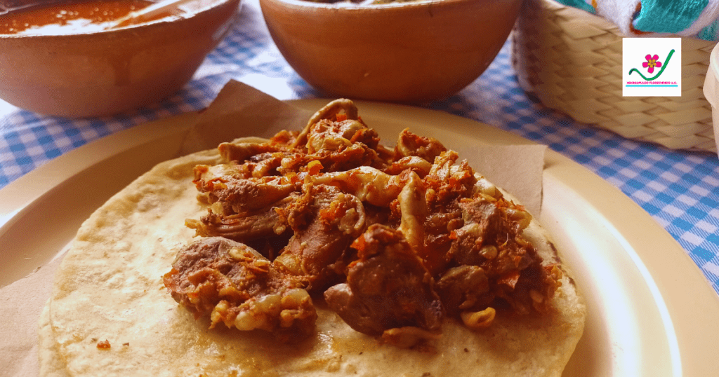 Un taco de pancita de barbacoa servido en una tortilla de maíz, listo para comer.