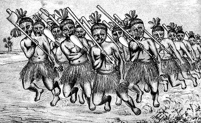 Un grupo de guerreros maoríes realizando el Haka y mostrando por qué sacan la lengua como señal de desafío.
